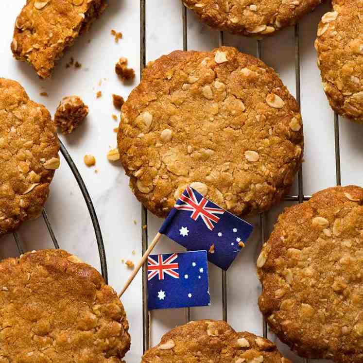 Overhead photo of Anzac biscuits on a cooling rack, fresh out of the oven