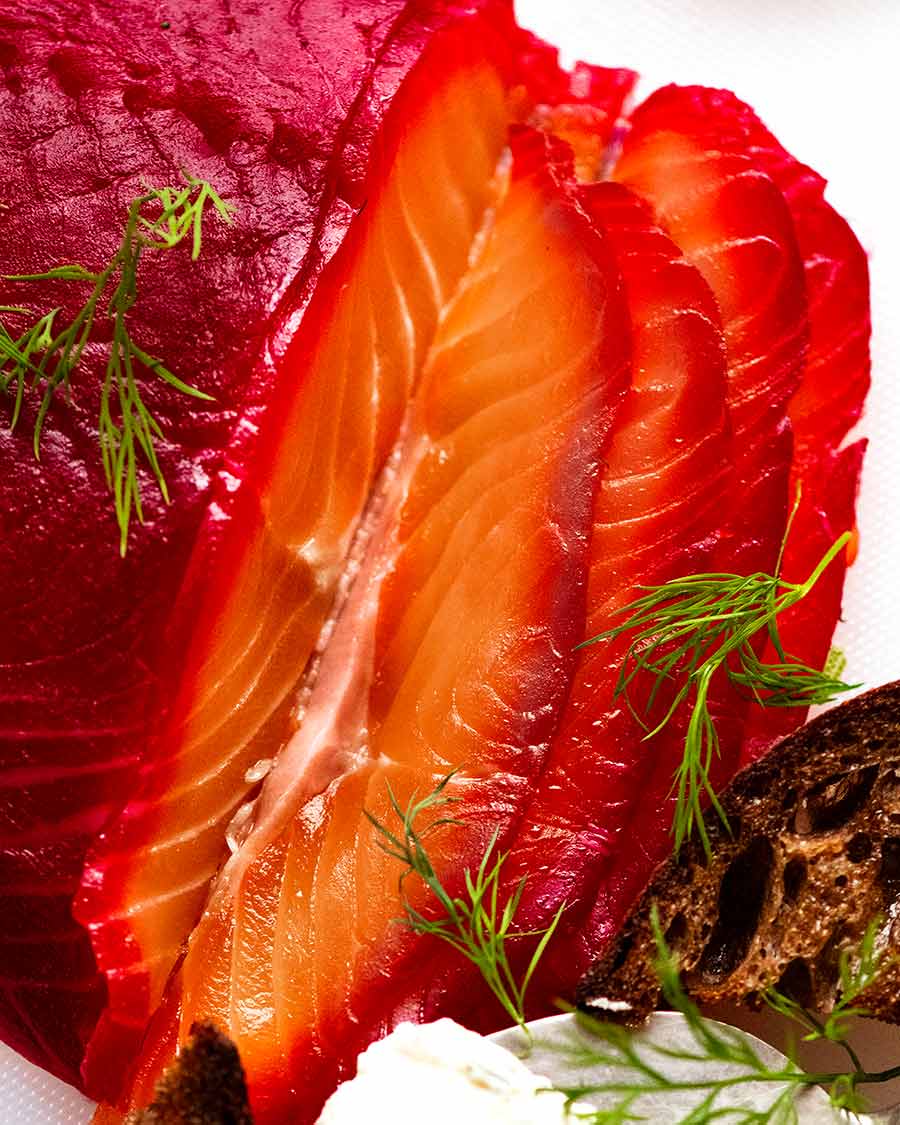 Close up photo of slices of Beetroot Cured Salmon (Gin or Vodka, Salmon Gravlax)
