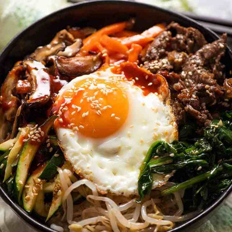 Close up of Bibimbap Korean Rice Bowl with Bibimbap Sauce, ready to be eaten