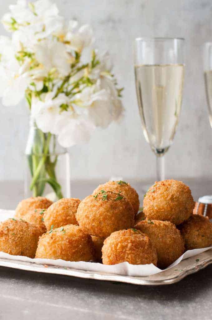 Cheesy Italian Arancini Balls -Creamy cheesy risotto rice, coated in panko and fried golden. The most EPIC Italian starter ever! recipetineats.com