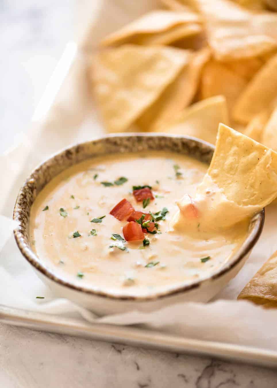 Code cracked: Queso Dip made with real cheese that's ultra silky even when it cools. www.recipetineats.com