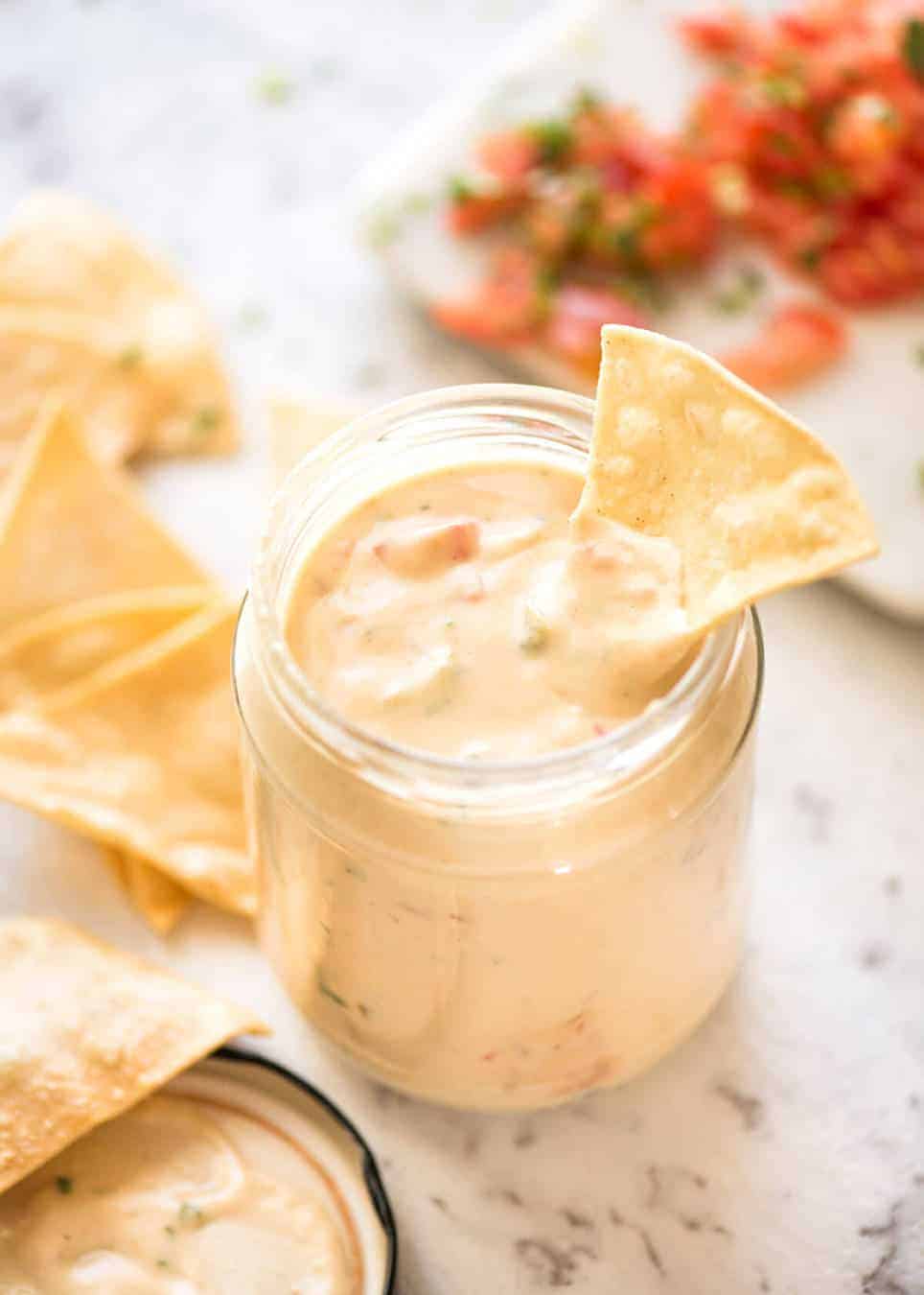 Code cracked: Queso Dip made with real cheese that's ultra silky even when it cools. www.recipetineats.com