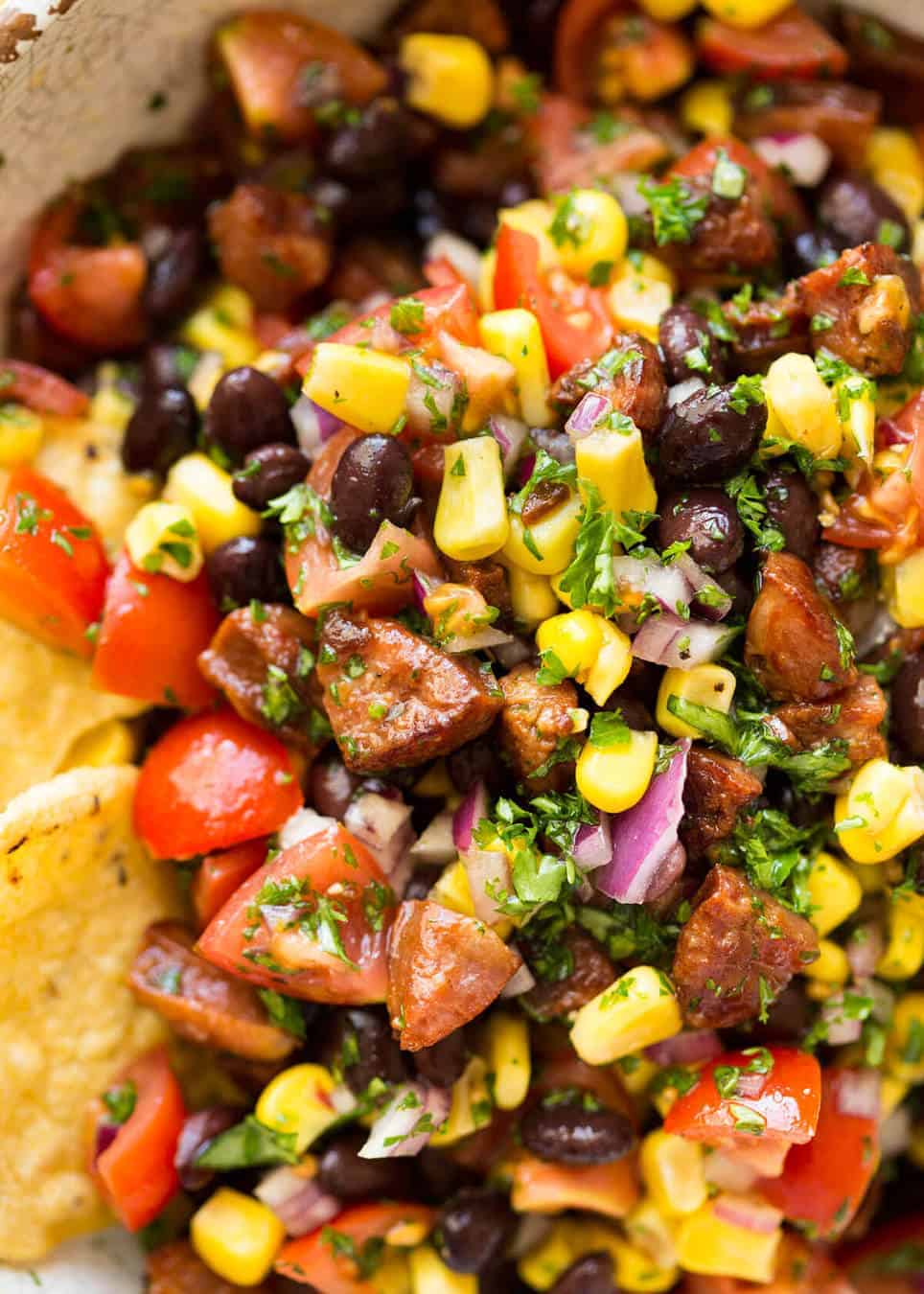 I call this a PIG OUT Salsa. Sensible people would call it an Chorizo, Black Bean and Corn Salsa. :) www.recipetineats.com