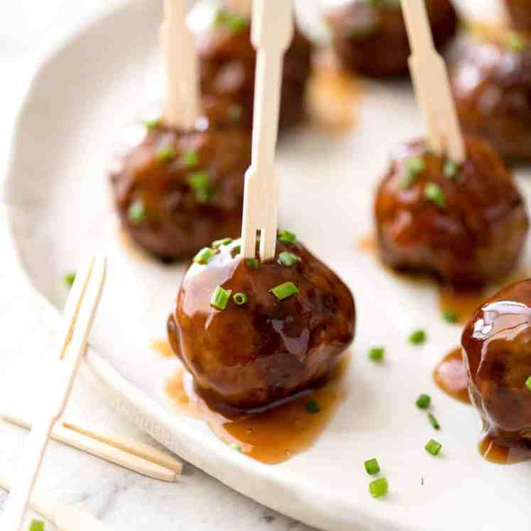 Plump, juicy and soft, these Party Cocktail Meatballs are baked and served with a fabulous Sweet & Sour Dipping Sauce that's super quick to make. Great make ahead for parties! recipetineats.com