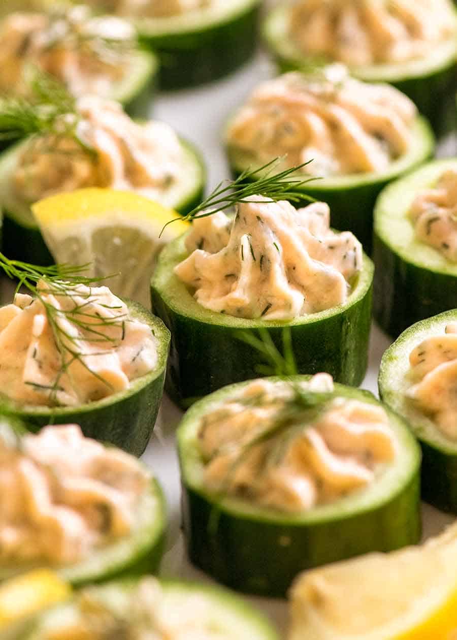 Close up of Cucumber Canapés topped with smoked salmon mousse garnished with dill