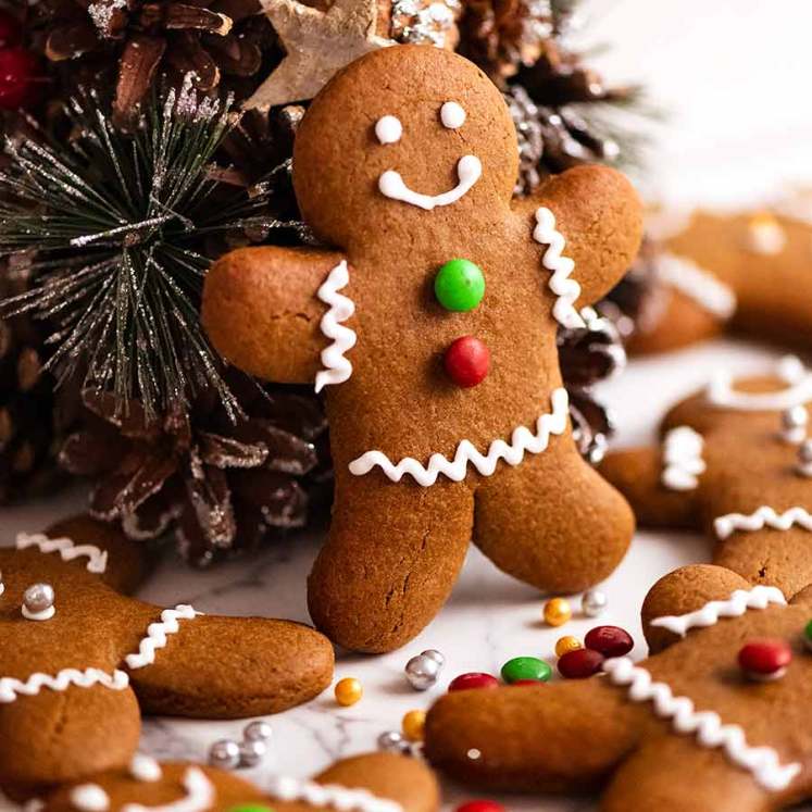 Gingerbread Men propped up on a mini Christmas tree