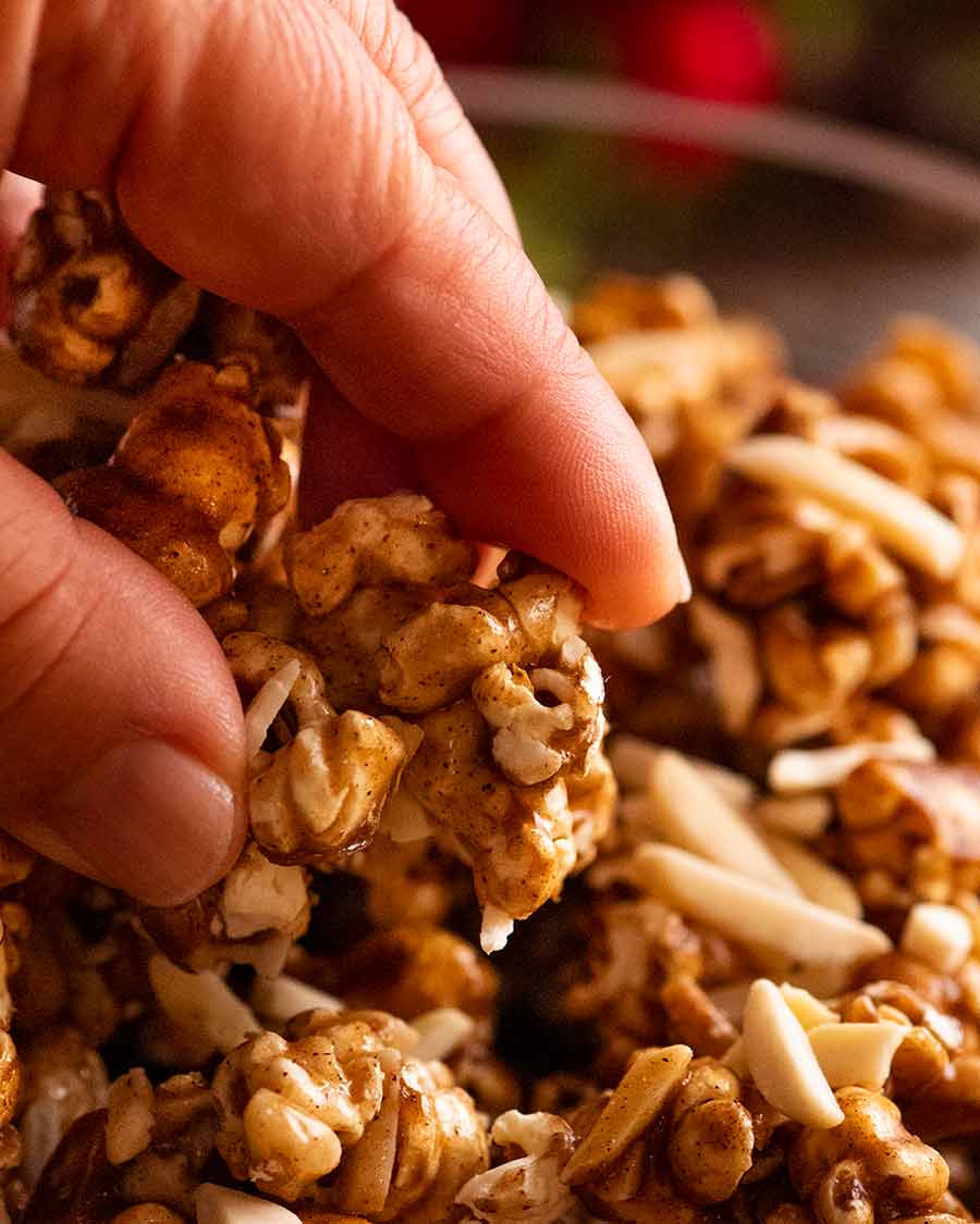 Close up of hand picking up Christmas Popcorn Candy