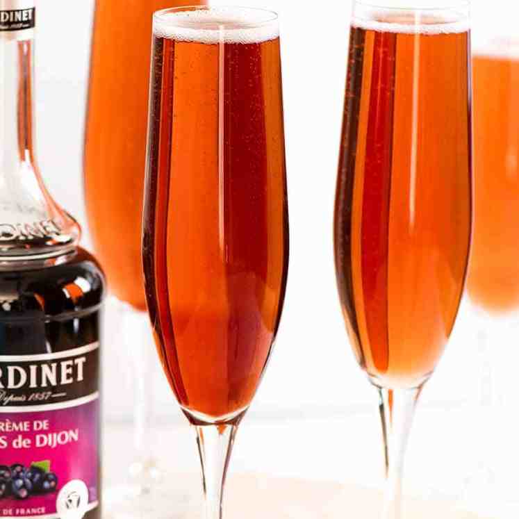 Kir Royale (French champagne cocktails) in champagne glasses, ready to be served