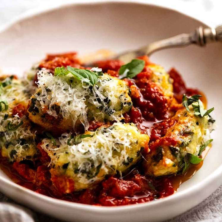 Bowl of Malfatti - Italian Spinach Ricotta Dumplings, ready to be eaten