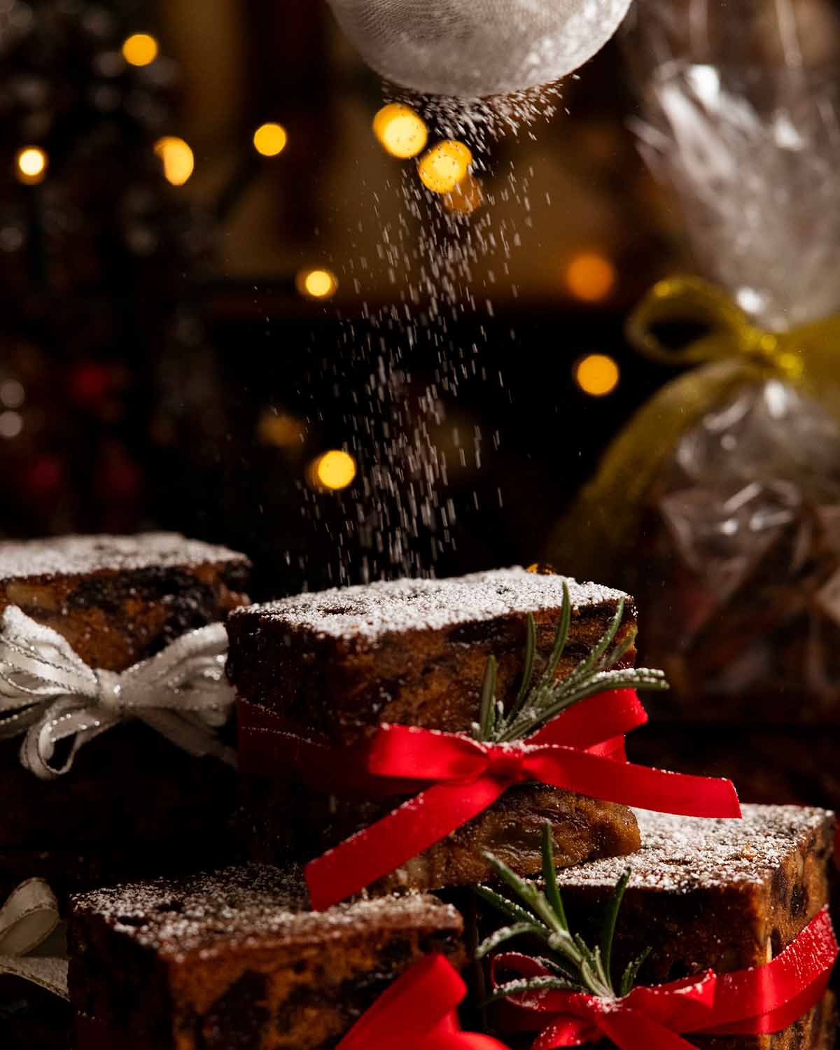 Dusting Mini Christmas Cakes with icing sugar