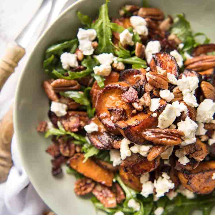 Roasted Sweet Potato Salad - with arugula/rocket, pecans, goats cheese or feta, a sprinkle of bacon and a beautiful Honey Lemon dressing. recipetineats.com